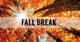 Trees with red, orange, and yellow leaves with the sun shining through that says Fall Break